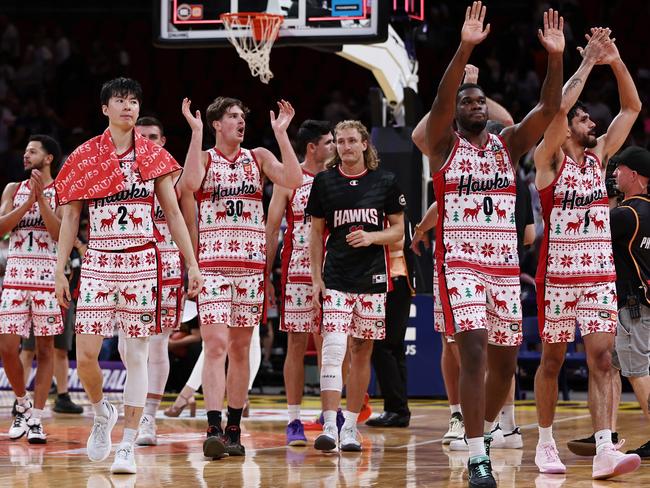 Hawks players celebrate their win over the Kings. Picture: Getty Images