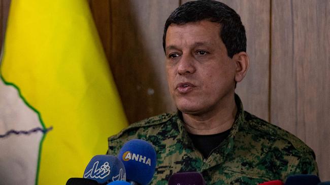 Syrian Democratic Forces (SDF) commander-in-chief Mazloum Abdi speaks to reporters.