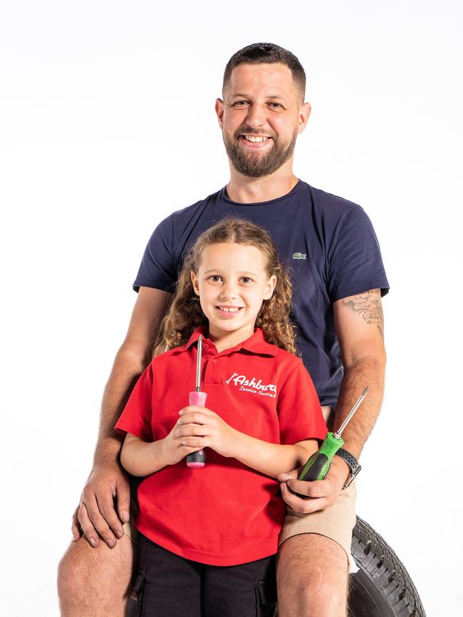 Kindergarten student Chloe, with Dad Danny, is excited about going to school and becoming her dream profession – a mechanic. Picture: Tom Parrish