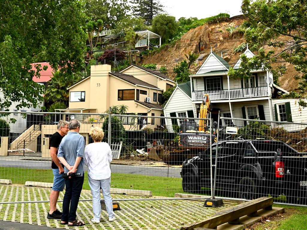 Neighbours watch as a property in Remuera is cleared in Auckland. Picture: Getty Images