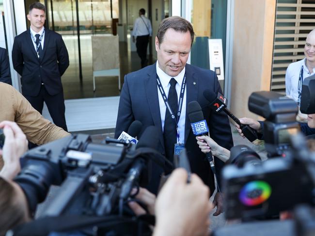 A detective fields questions outside the Carnarvon Courthouse. Picture: Tamati Smith/Getty