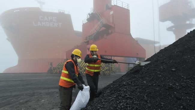 Chinese officials inspect coal imports. Picture: Getty Images