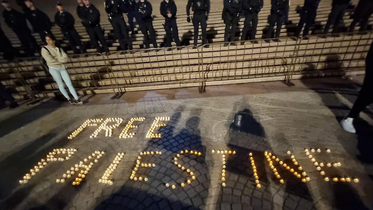 Tealights spelling "Free Palestine" were placed in front of police outside of the Opera House. Picture: News.com.au / Jasmine Kazlauskas