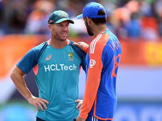 David Warner and Virat Kohli share a moment after India’s win over Australia. Picture: Gareth Copley/Getty Images