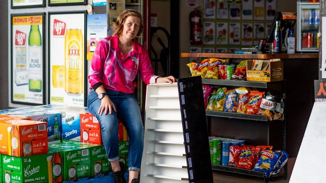 Berry Springs Tavern manager Liz Lamb holding one of the empty cigarette draws that was raided on Tuesday. Picture: Che Chorley