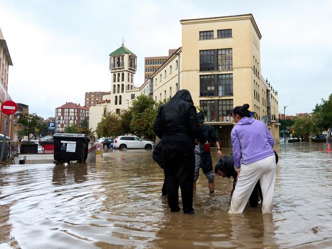 Residents try to open sewers in Malaga. Picture: Getty Images