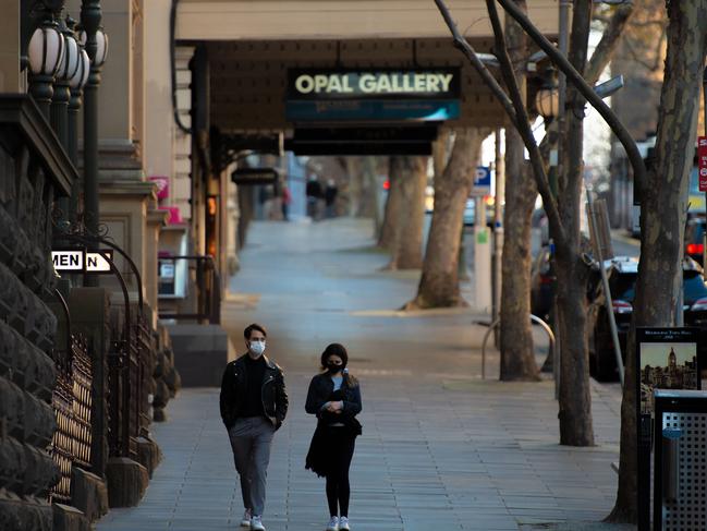 Empty scenes around Melbourne CBD as Corona virus Covid 19 stage 4 restrictions in place impose curfews. People in masks around the city of Melbourne. Picture: Jason Edwards