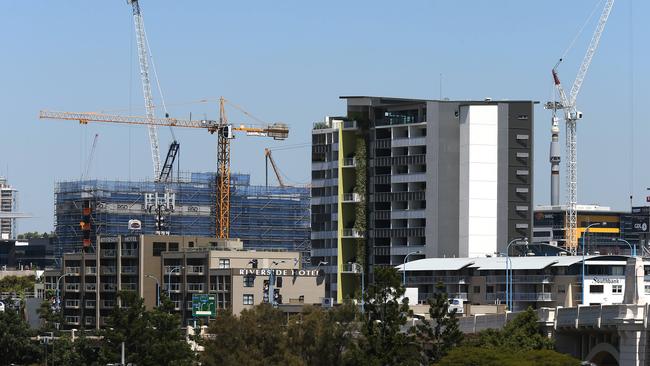 views of cranes building high rise apartment blocks on the South Brisbane skyline .