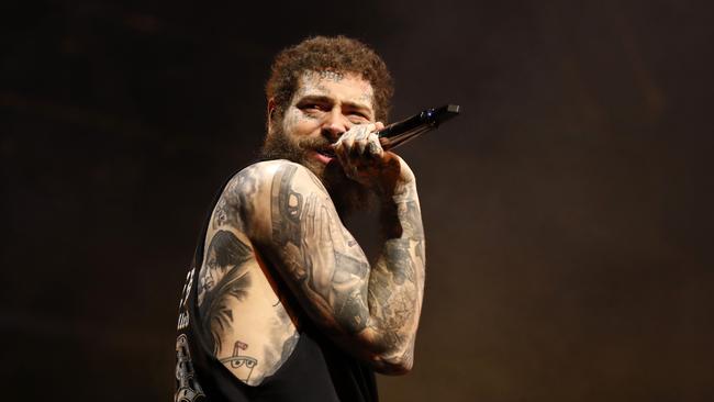 Post Malone on stage at the Domain last night. Picture: Jonathan Ng