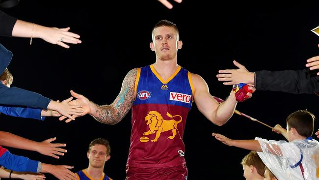 Dayne Beams high-fives the fans after Brisbane’s win. Picture: Getty Images