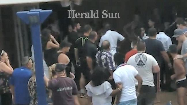 Security intervene during a scuffle on the deck