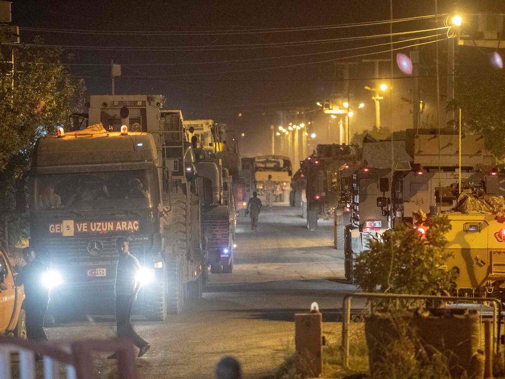 Turkish army soldiers drive towards the border with Syria province on October 8, 2019. Picture: BULENT KILIC / AFP.