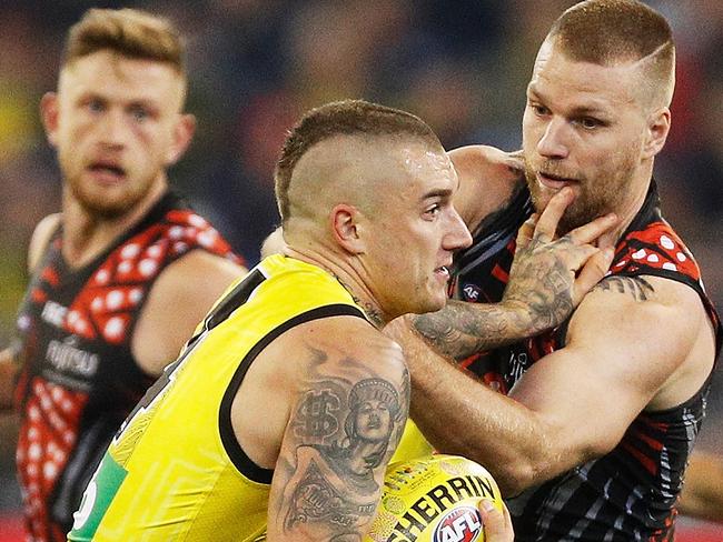 MELBOURNE, VICTORIA - JUNE 02:  Dustin Martin of the Tigers and Jake Stringer of the Bombers contest the ball during the round 11 AFL match between the Essendon Bombers and the Richmond Tigers at Melbourne Cricket Ground on June 2, 2018 in Melbourne, Australia.  (Photo by Daniel Pockett/AFL Media/Getty Images)