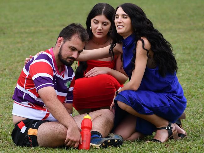 Ethan Carbone is administered first aid for an arm injury by two women attending the Ingham Rugby Club’s Ladies Day on Saturday. Photographs from the Ingham Cutters Rugby Club round of home games and Ladies Day at Brothers Sport Club in Cooper Street on Saturday. Picture: Cameron Bates