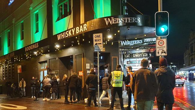 A queue of people outside a busy bar, the kind of activity the government is warning against. Picture: Damian Shaw