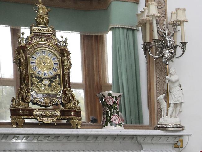 Britain's Queen Elizabeth II also has antique candlestick holders and a clock. Picture: AP