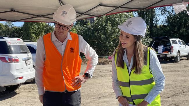 Transport Minister Bart Mellish and Housing Minister Meaghan Scanlon look over plans for the Coomera Connector