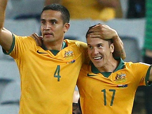 SYDNEY, AUSTRALIA - JANUARY 13: Matt McKay of the Socceroos is congratulated by team mates after scoring a goal during the 2015 Asian Cup match between Oman and Australia at ANZ Stadium on January 13, 2015 in Sydney, Australia. (Photo by Cameron Spencer/Getty Images)