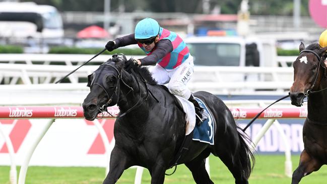 Vlad Duric powers to victory aboard Antino for trainer Tony Gollan in the Group 2 Victory Stakes at Eagle Farm. Picture: Grant Peters - Trackside Photography.