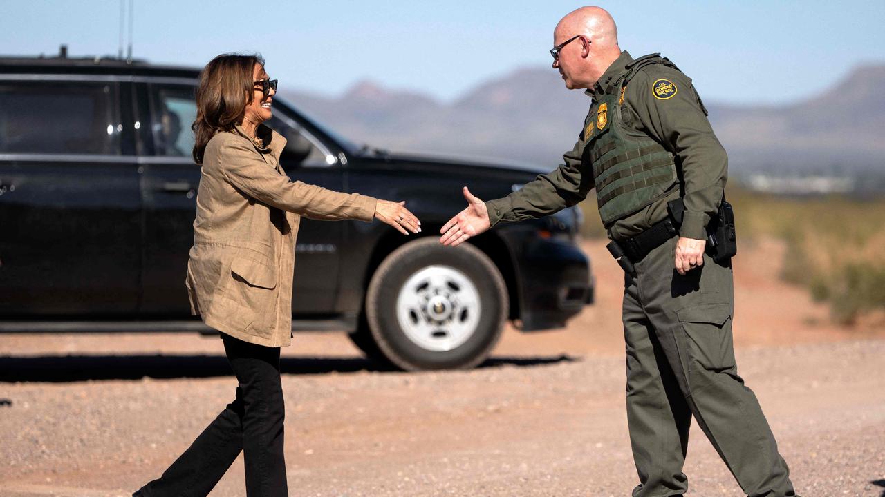 Kamala Harris (L) shakes hands with US Border Patrol Tucson Sector Chief John Modlin (R) as she visits the US-Mexico border in Douglas, Arizona. Picture: AFP