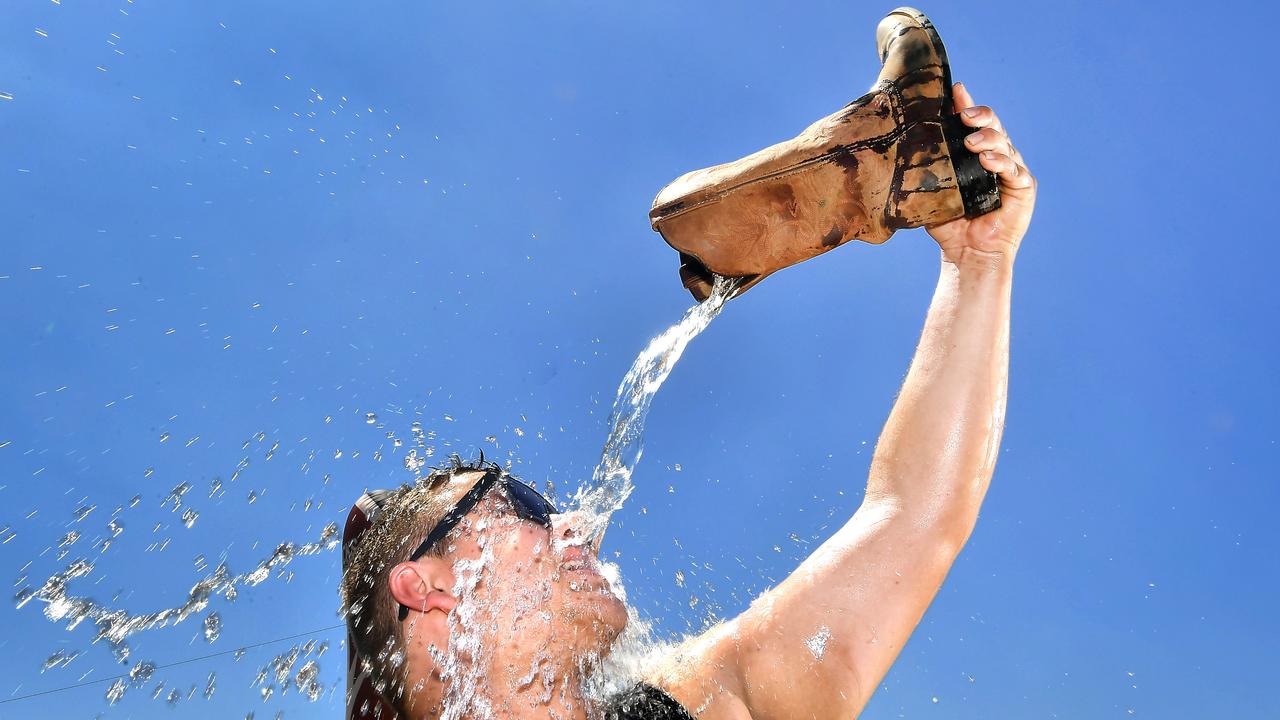 Tom Trewick grabs a boot full of water to cool down at CMC Rocks Friday March 17, 2023. Picture John Gass