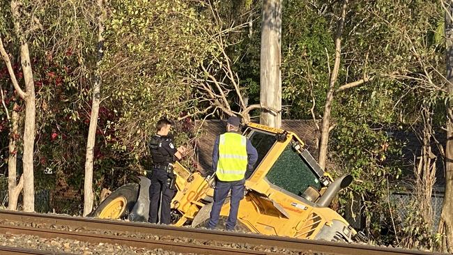 A stolen digger beside the train line which has caused the suspension of Ipswich/Rosewood line services. Picture: 9 News