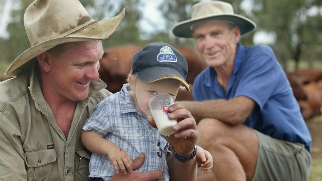 Grant, Alec and Noel Wieck enjoy fresh milk from the family's award-winning dairy farm in 2012.