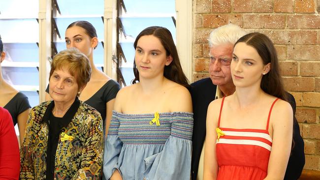 Allison Baden-Clay's two eldest daughters Sarah, 14, in blue, and Hannah, 16, in red, with their grandparents. Picture: Liam Kidston