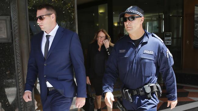 Police connected with the case outside Downing Centre Court in Sydney. Picture: Richard Dobson