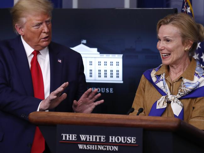 President Donald Trump reacts as Dr. Deborah Birx, White House coronavirus response co-ordinator, speaks about the coronavirus in Washington. Picture: AP