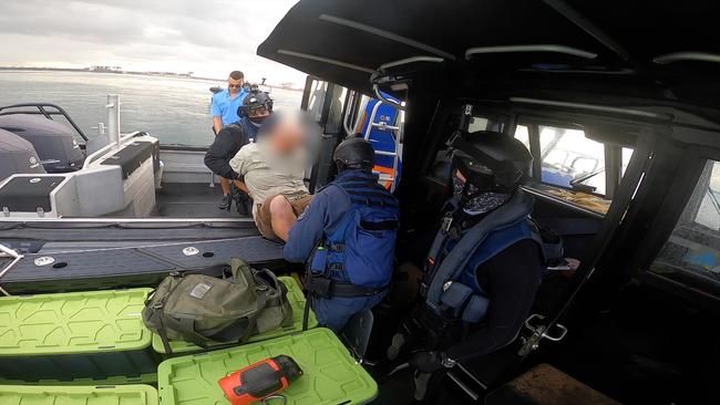 Officers descend on the boat yesterday. Picture: NSW police