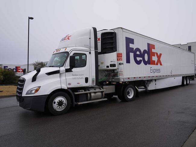 FedEx trucks holding boxes containing the Moderna COVID-19 vaccine are prepared to depart from a Mississippi depot. Picture: AFP