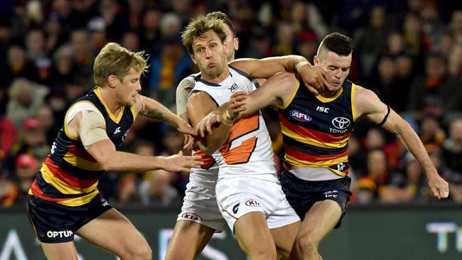 Matt De Boer of the Giants is sandwiched by Crows Rory Sloane and Brad Crouch at Adelaide Oval on Saturday night. Picture: AAP Image/Sam Wundke