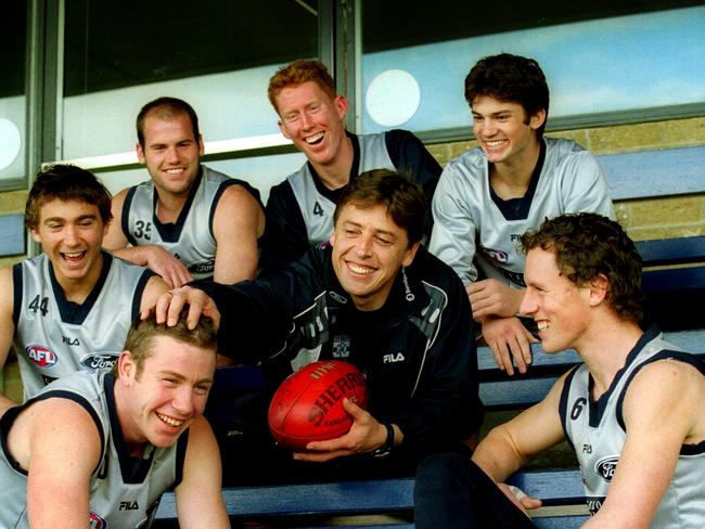 Geelong coach Mark Thompson with young players (from left, clockwise) Steve Johnson, Corey Enright, Paul Chapman, Cameron Ling, Jarad Rooke (Max Rooke) and James Kelly in 2002.