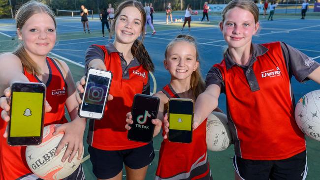 Much of the content is harmless, fun and feel-good but experts want parents to be aware of some of the dangerous trends on social media apps such as TikTok. Mt Barker United Netball Club players Eleanor, Maddie, Trinity and Airlee have no issue setting their phones aside to play sport. Picture: Brenton Edwards