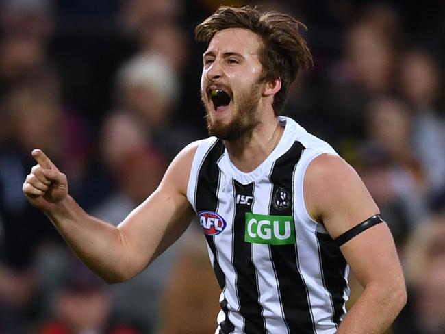 ADELAIDE, AUSTRALIA - AUGUST 17: Tom Phillips of the Magpies celebrates a goal during the round 22 AFL match between the Adelaide Crows and the Collingwood Magpies at Adelaide Oval on August 17, 2019 in Adelaide, Australia. (Photo by Mark Brake/Getty Images)