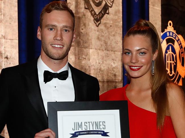 MELBOURNE, AUSTRALIA - SEPTEMBER 25: Jack Hombsch of the Power is presented with the Jim Stynes Community Leadership Award by Matisse Stynes during the 2017 Brownlow Medal Count at the Crown Palladium on September 25, 2017 in Melbourne, Australia. (Photo by Michael Willson/AFL Media)