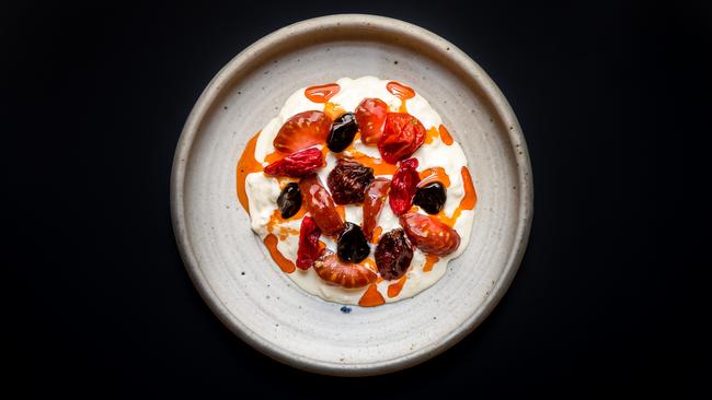 Stracciatella cheese, steamed mussels and clams, marigold, olive oil at Blackwattle in Singapore. Supplied