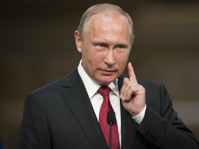 FILE - In this May 29, 2017, file photo, Russian President Vladimir Putin gestures as he speaks during a news conference with French President Emmanuel Macron at the Palace of Versailles, near Paris. Trump is eager to meet Russian President Vladimir Putin with full diplomatic bells and whistles when the two are in Germany for a multinational summit next month. (AP Photo/Alexander Zemlianichenko, File )