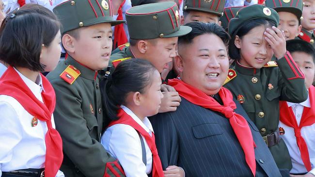 North Korean leader Kim Jong-un (C) with a group of North Korean children. Picture: AFP