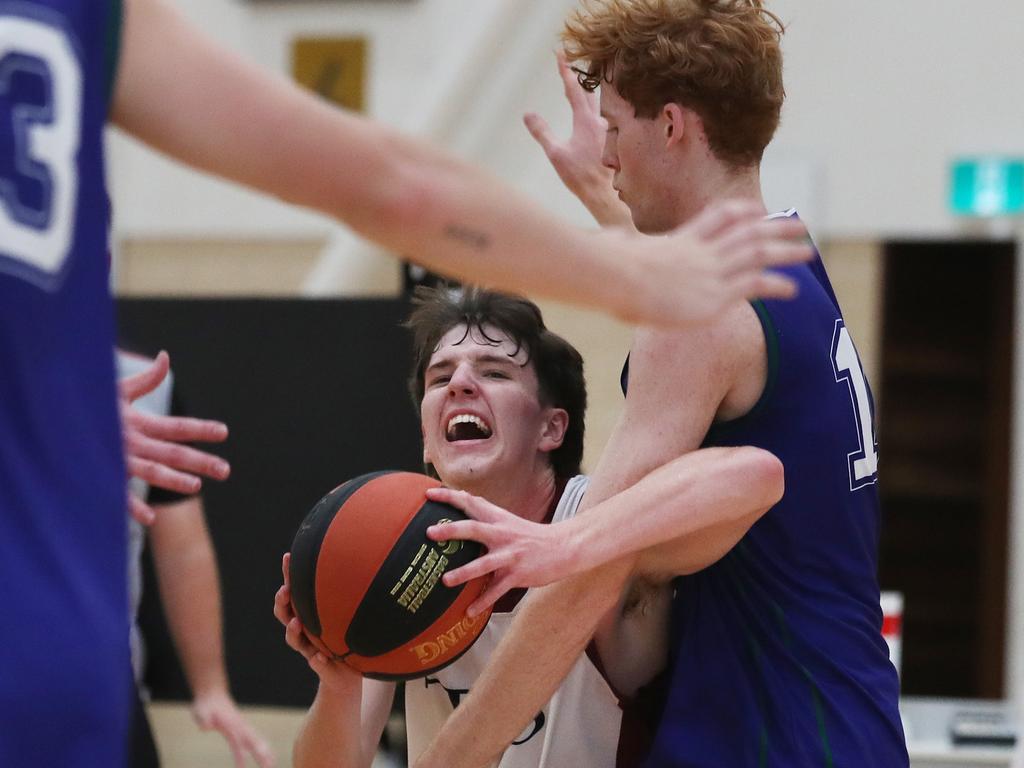 Basketball Australia Schools Championships at Carrara. Mens open final, Lake Ginninderra College Lakers V TSS (in white). the Lakers defence gave Benjamin Tweedy from TSS special attention in the final. Picture Glenn Hampson