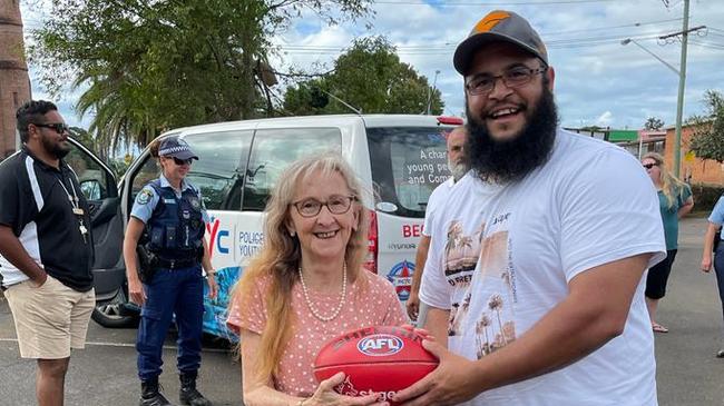 GWS Giants volunteers help deliver food to flood victims in Lismore. Supplied