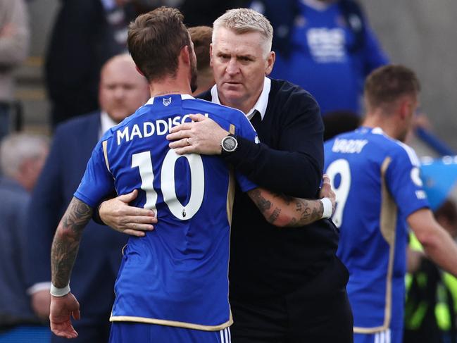 Leicester City's English midfielder James Maddison (L) hugs Leicester City's English manager Dean Smith at the end of the English Premier League football match between Leicester City and West Ham United at King Power Stadium in Leicester, central England on May 28, 2023. Leicester City wins 2 - 1 against West Ham United, but gets relegated from the Premier League. (Photo by DARREN STAPLES / AFP) / RESTRICTED TO EDITORIAL USE. No use with unauthorized audio, video, data, fixture lists, club/league logos or 'live' services. Online in-match use limited to 120 images. An additional 40 images may be used in extra time. No video emulation. Social media in-match use limited to 120 images. An additional 40 images may be used in extra time. No use in betting publications, games or single club/league/player publications. /