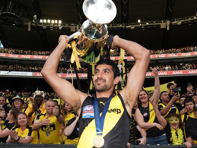 Marlion Pickett of the Tigers celebrates the win with the Premiership Cup during the 2019 AFL Grand Final between the Richmond Tigers and the GWS Giants at the MCG in Melbourne, Saturday, September 28, 2019. (AAP Image/Michael Dodge) NO ARCHIVING