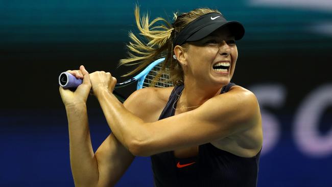 NEW YORK, NEW YORK - AUGUST 26:  Maria Sharapova of Russia returns a shot during her Women's Singles first round match against Serena Williams of the United States during day one of the 2019 US Open at the USTA Billie Jean King National Tennis Center on August 26, 2019 in the Flushing neighborhood of the Queens borough of New York City.  (Photo by Matthew Stockman/Getty Images)