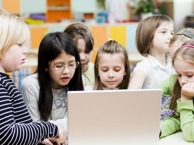 Cute children using laptop at the classroom