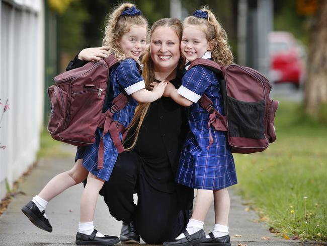 Twins Mila and Mika, 4, are getting ready to start Prep. Born at 28 weeks at 900g after an experimental trial, they were given blood transfusions in the womb to give them more of a chance to grow inside mum. Simone Lichtenstein with her twin daughters Mila and Mika excited about finally going to school.     Picture: David Caird