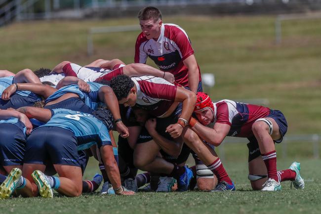 Adam Latham (back, middle) packs down the scrum with teammates in the Queensland Reds and New South Wales Waratahs academy bout earlier this year.