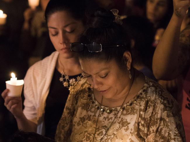 Mourners participate in a candlelight vigil held for the victims of a fatal shooting at the First Baptist Church in Sutherland Springs, Sunday, Nov. 5, 2017, in Sutherland Springs, Texas. Picture: AP.