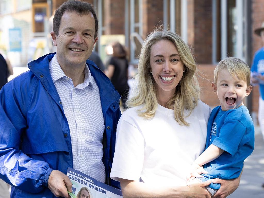 NSW Opposition Leader Mark Speakman caught up with the Liberal Pittwater candidate Georgia Ryburn, hoding her two-year-old son Harvey, at the Mona Vale Memorial Hall. Picture: Daily Telegraph / Brendan Read